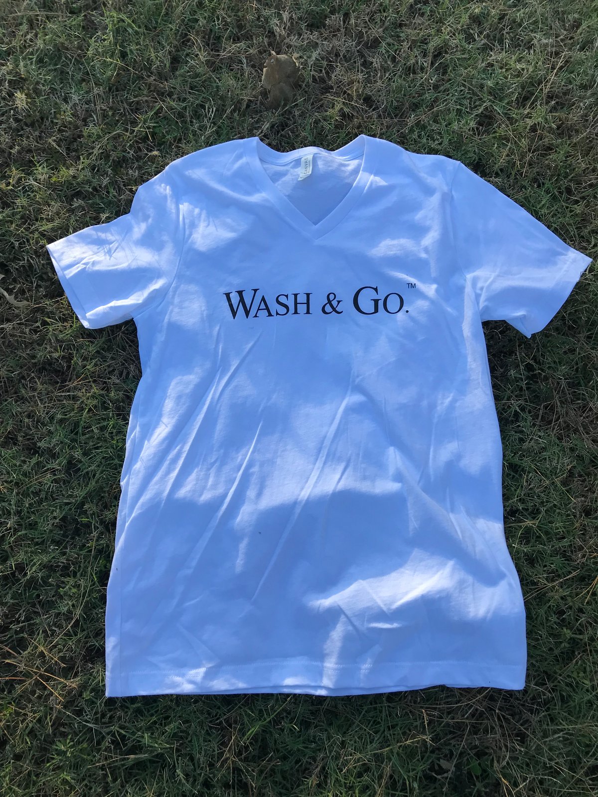 Image of WASH & GO.™ White V-neck Tee