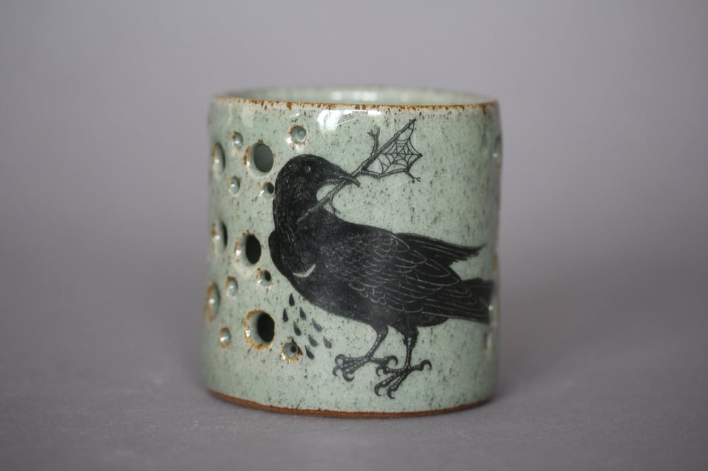 Hare and rook candle holder.