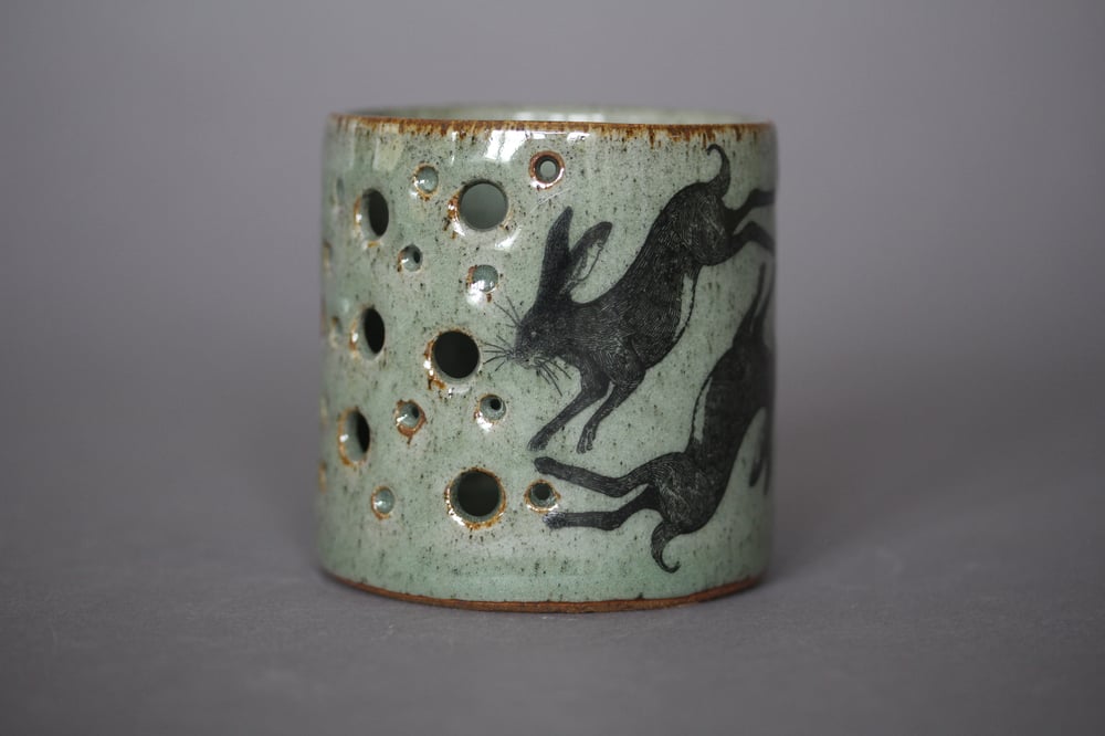 Hare and rook candle holder.