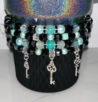 Image 1 of Teal and Black Midnight Glitz’s Tumbler Bracelet Stack