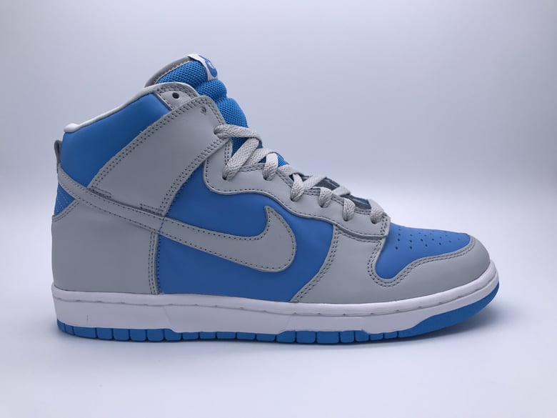 Image of NIKE DUNK HIGH "NT GREY/NT GREY-UNIV BLUE"
