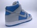 Image of NIKE DUNK HIGH "NT GREY/NT GREY-UNIV BLUE"