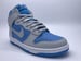 Image of NIKE DUNK HIGH "NT GREY/NT GREY-UNIV BLUE"