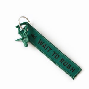 Image of RUSH TO WAIT Keychain Tag