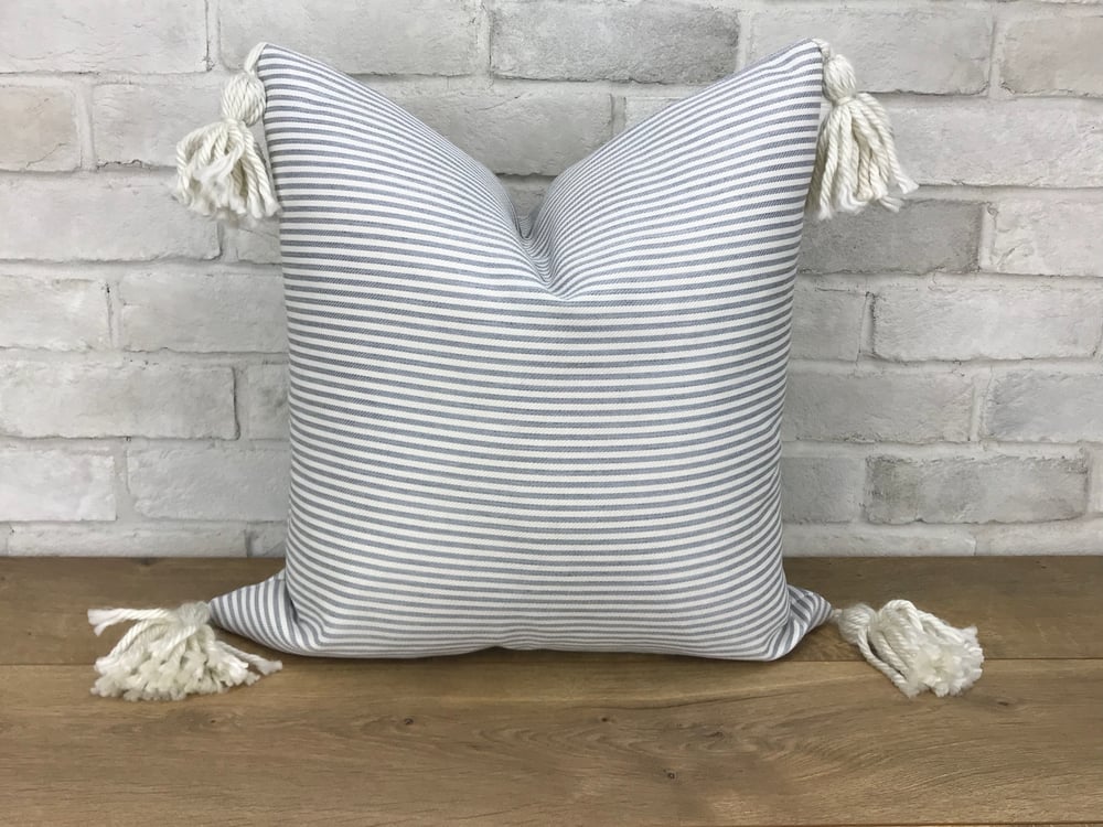 Image of Soft blue and cream stripe with cream corner tassels pillow cover
