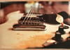 Fugazi- Ian MacKayes Gibson SG printed on metalic gold paper.