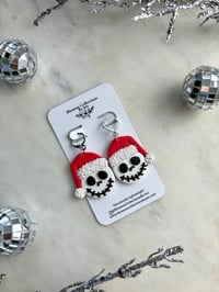 Image 1 of skeleton with Santas hat