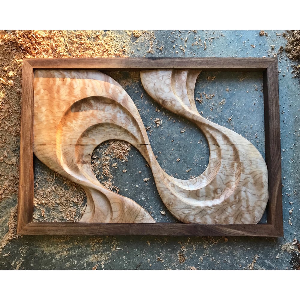 Image of Not a shell left unbroken. Quilted maple and walnut wall hanging.