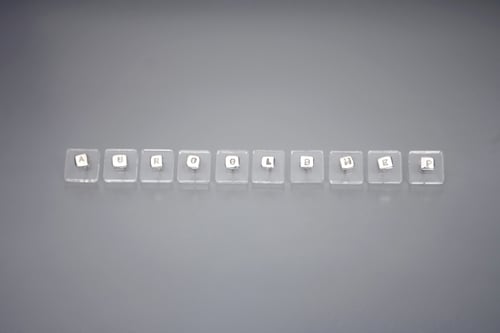 Image of silver earring with letter