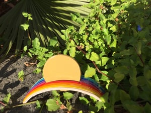 Image of Rainbow cradles the Sun