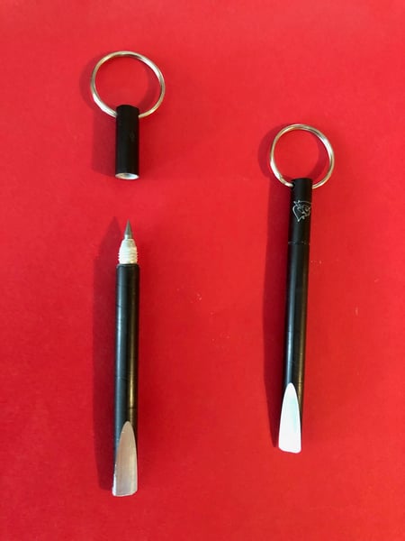 Image of white ninja scriber-gallon opener key chain