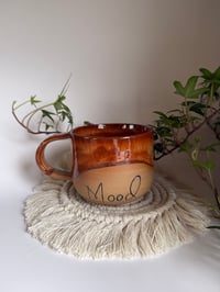 Phrase mug-‘mood’ brown