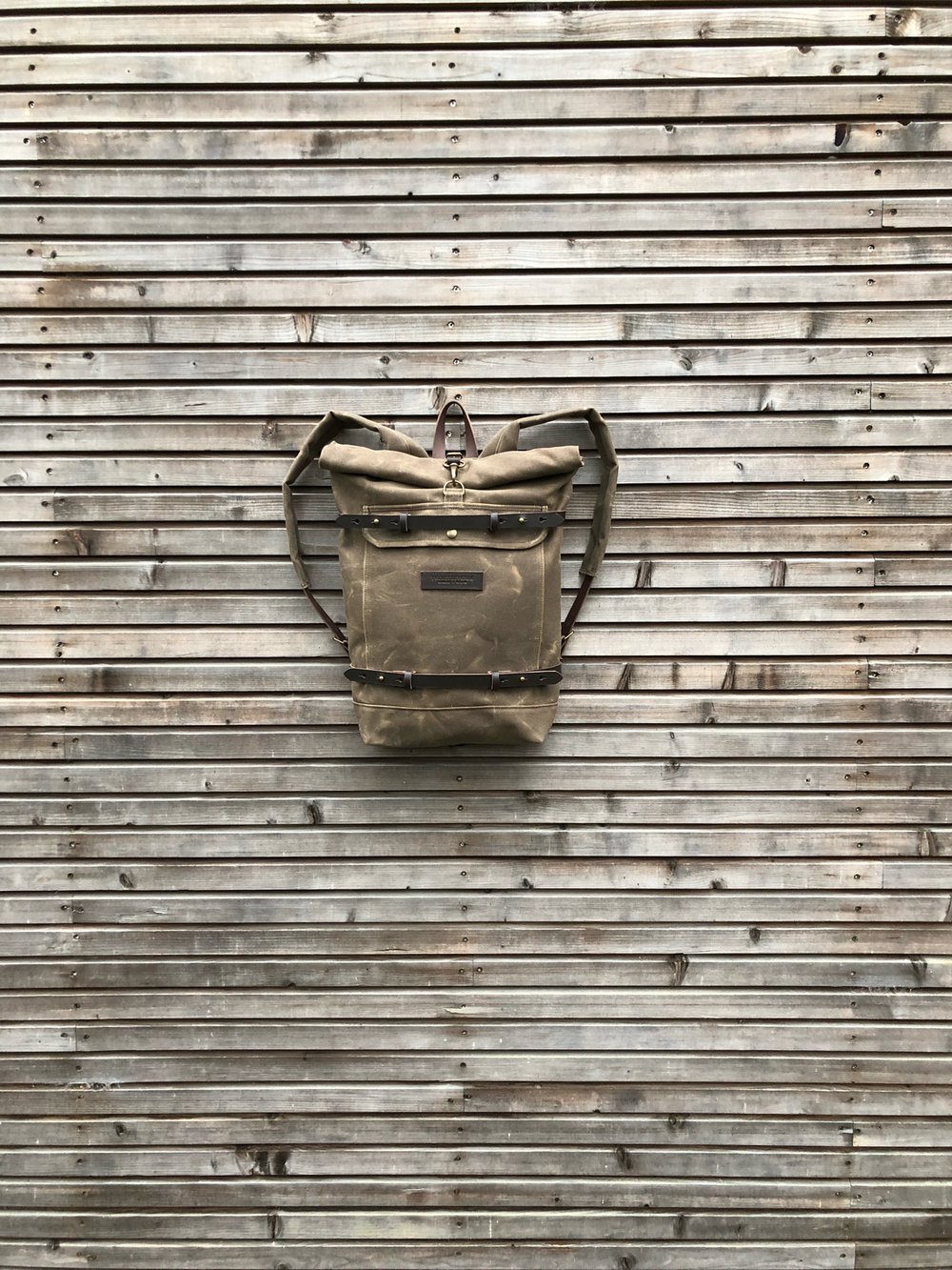 Image of Waxed canvas backpack - rucksack with folded top and waxed canvas padded shoulder straps