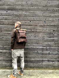Image 4 of Leather backpack with waxed canvas roll to close top and leather front pocket
