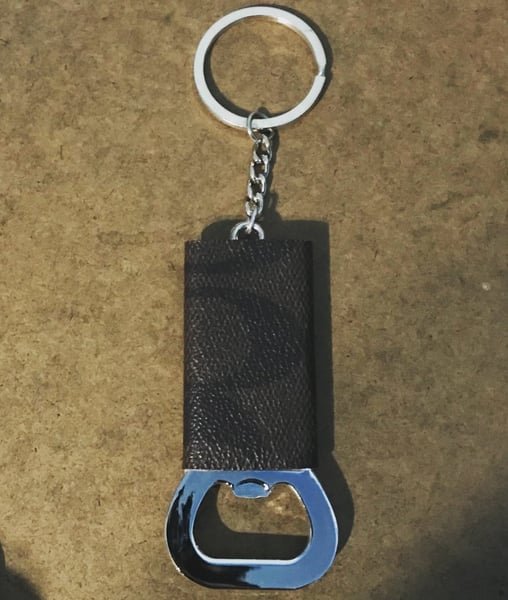 Image of Coach keychain bottle openers