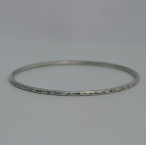 Image of Hammered silver bangles