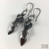 Venenum Earrings