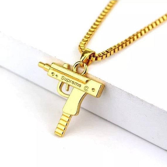 supreme gold uzi chain