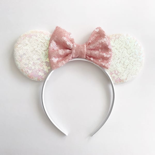 Image of White iridescent sequin mouse ears with blush sequin bows