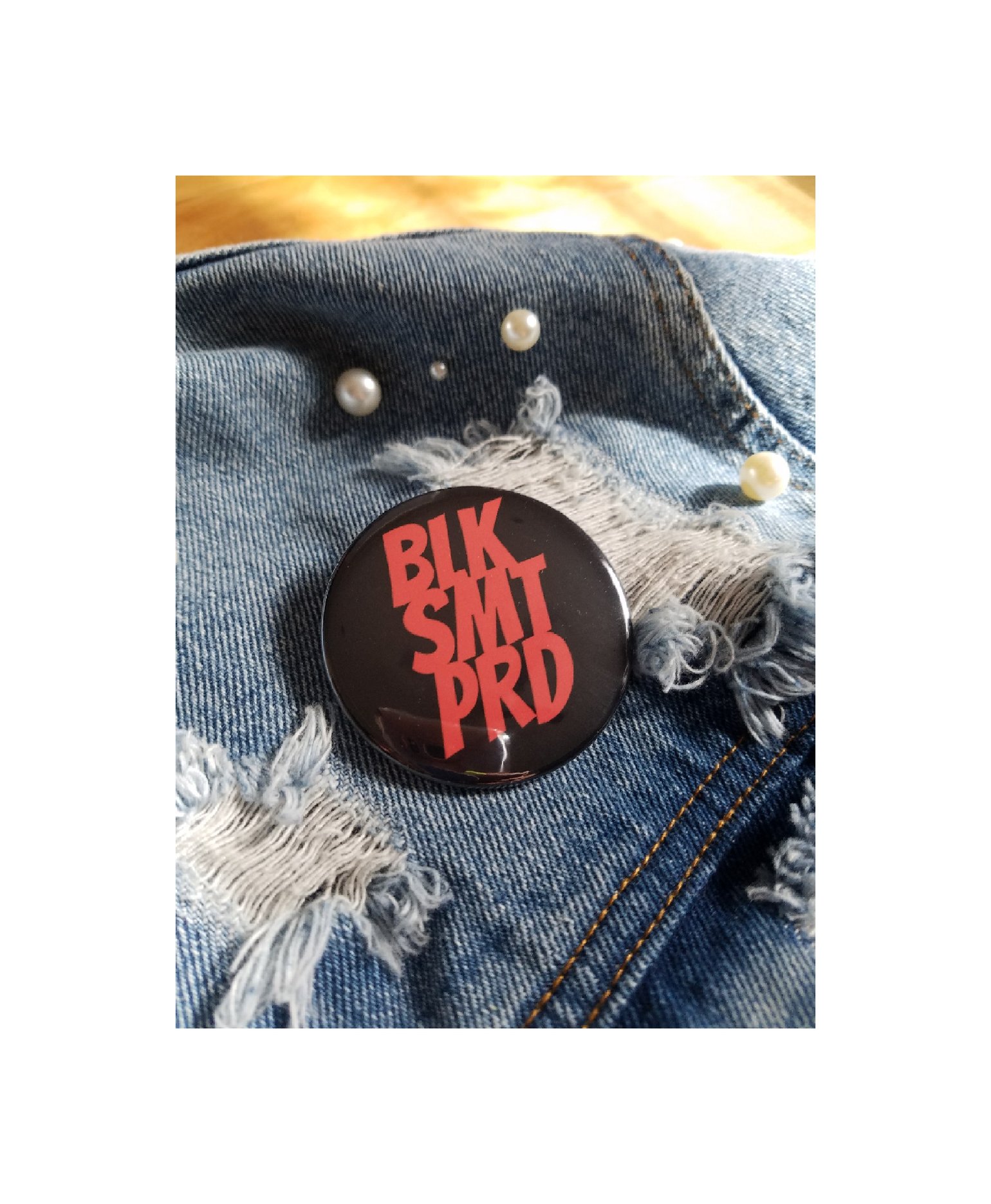 Image of BLK SMT PRD Logo Button (black/red)