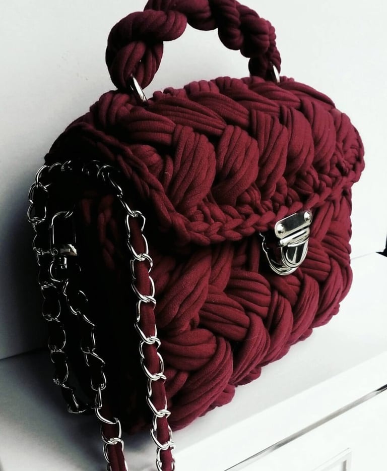 Crochet purses with a handle and chains .