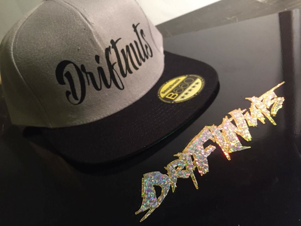 Image of Driftnuts swirl font printed flat peak snapback