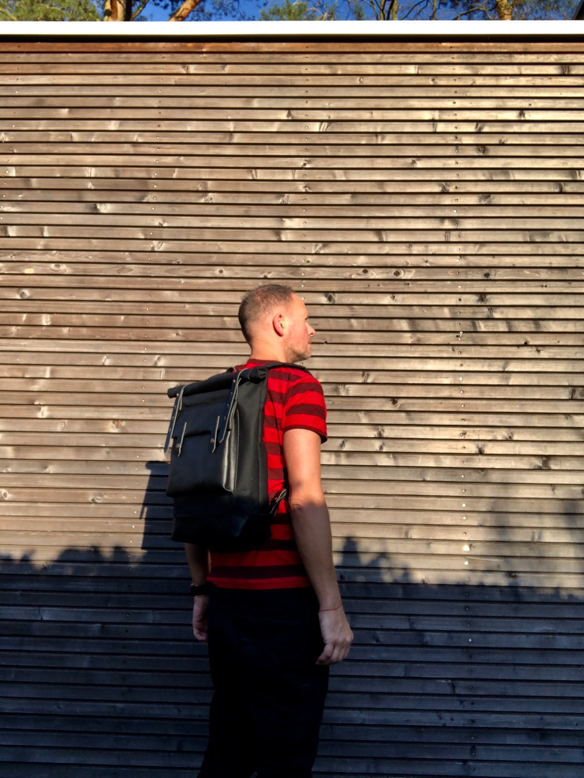 Image of Black waxed canvas rucksack/backpack with roll up top and oiled leather bottem COLLECTION UNISEX