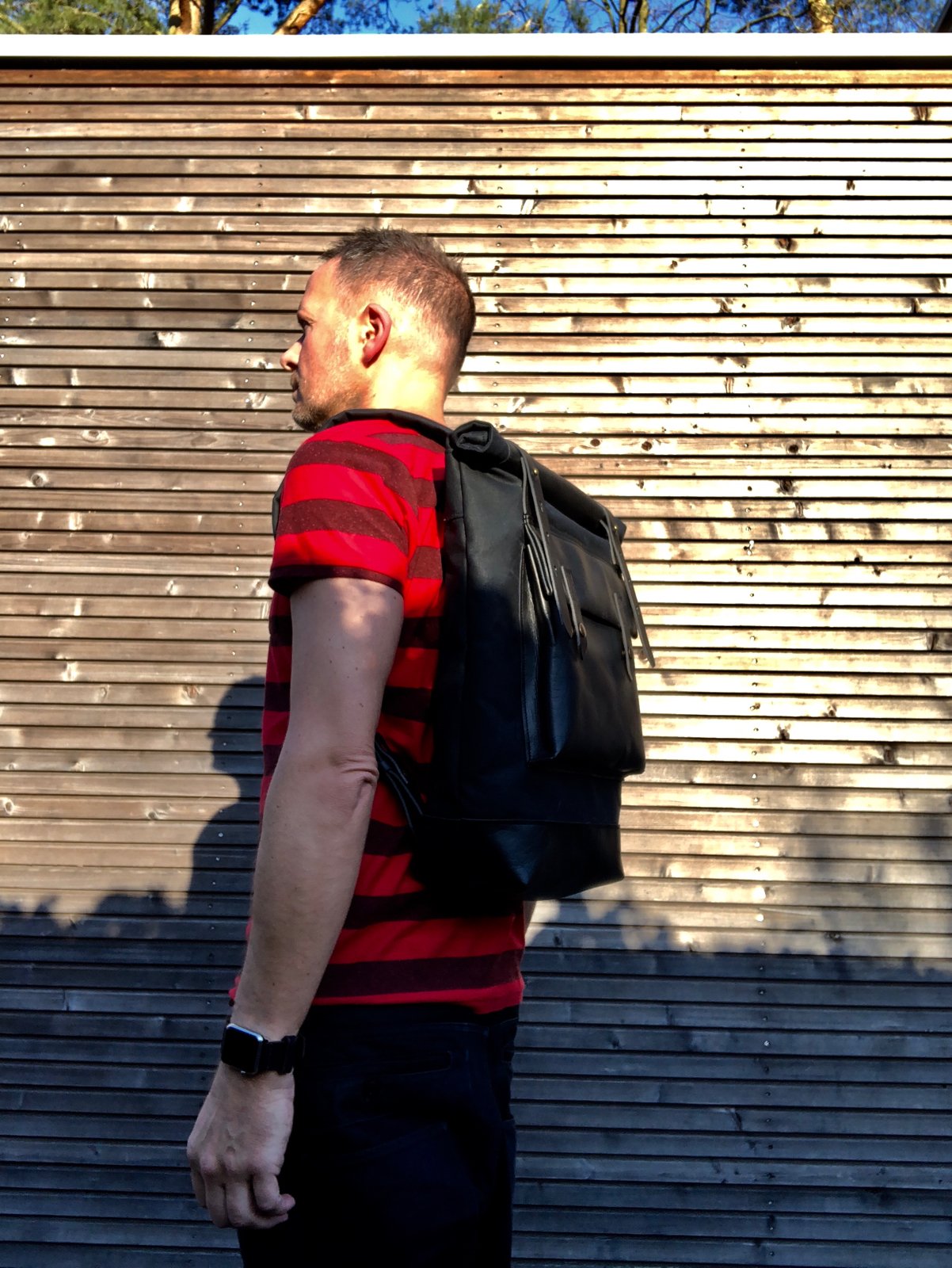 Image of Black waxed canvas rucksack/backpack with roll up top and oiled leather bottem COLLECTION UNISEX