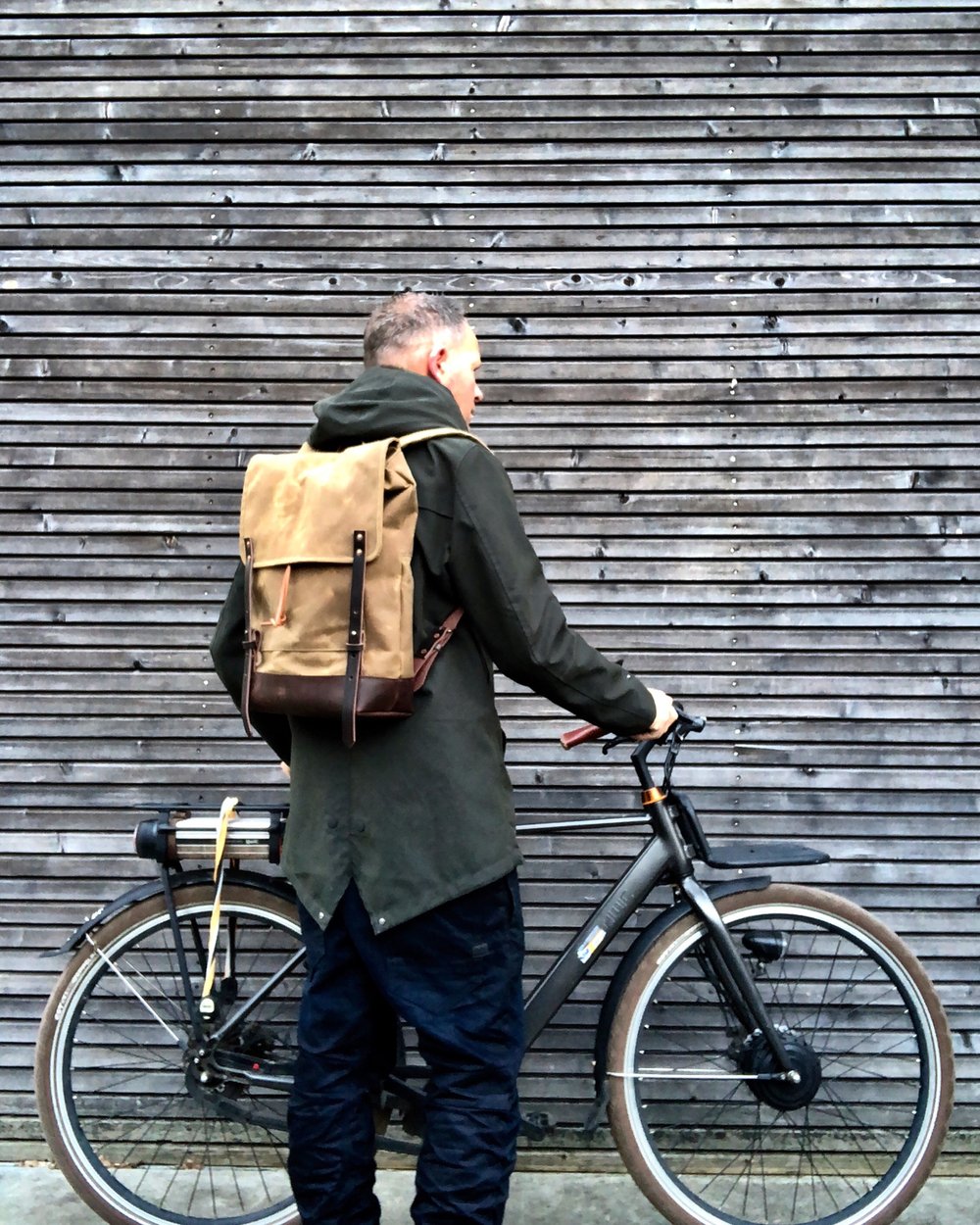 Waxed canvas backpack / rucksack with folded top and waxed canvas flap