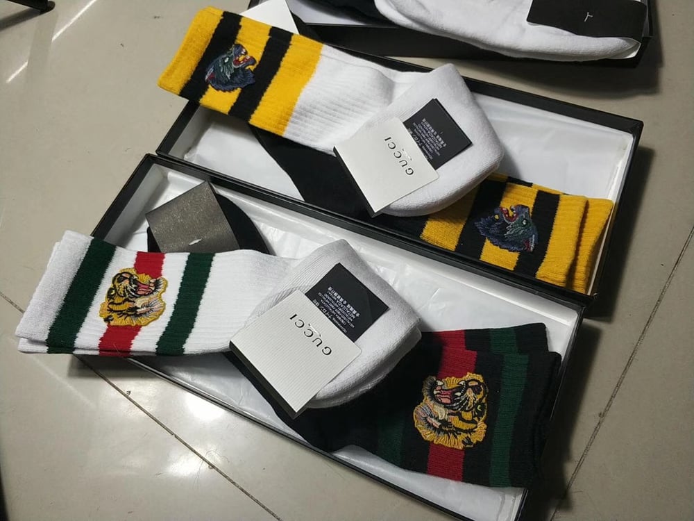 Image of gucci wolf/tiger head socks