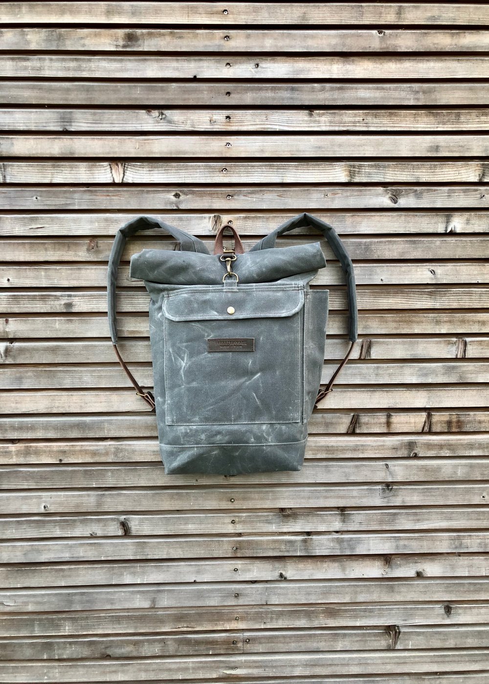 Image of Waxed canvas rucksack in charcoal grey with roll up top and double waxed bottem