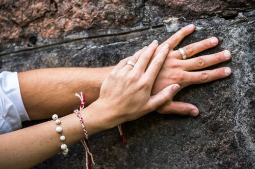 Image of silver wedding rings with inscription in Latin