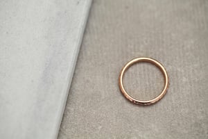 Image of 18ct rose gold 2mm laurel leaf and milled edge engraved ring