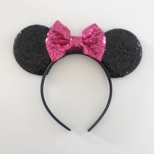 Image of Black sequin ears with bright pink bows