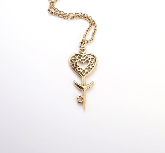 Image of Heart Space Key Pendant in Brass