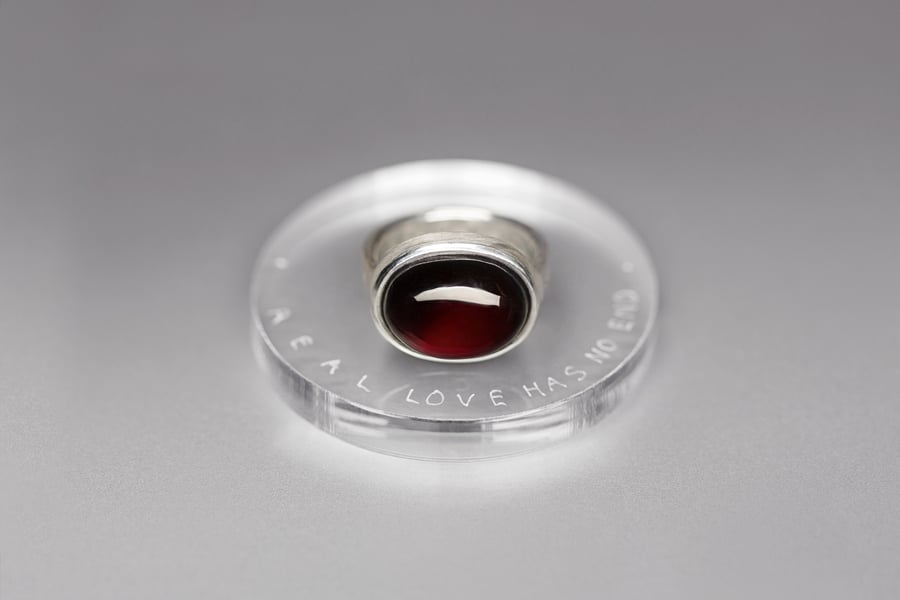 Image of "Real love has.." silver ring with garnet  · VERUS AMOR NULLUM.. ·