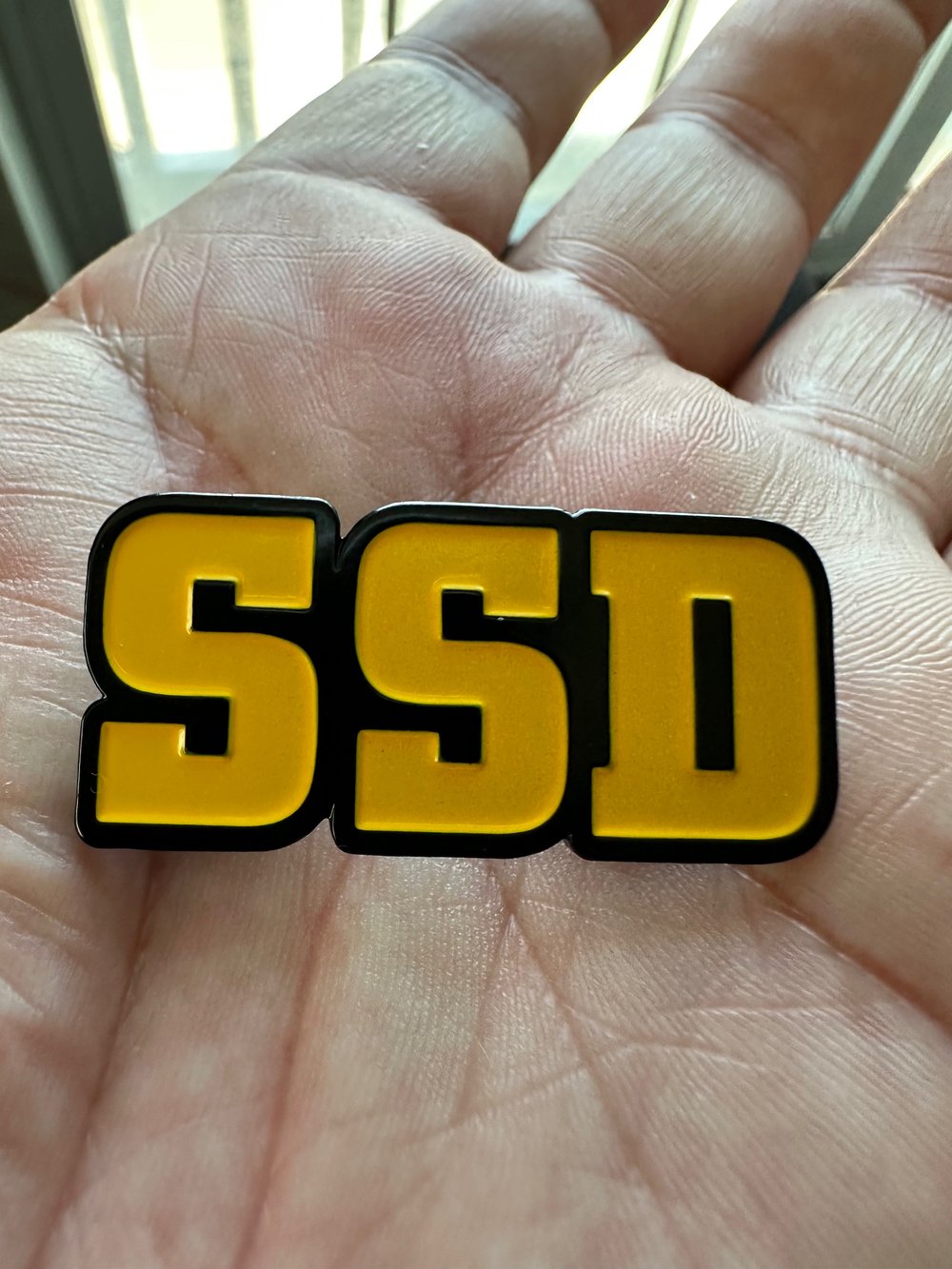 Gold SSD logo metal badge 