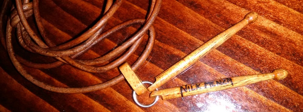 Image of Necklace / Wooden Carved Menza Logo 26 x 2mm Drumsticks Pendant