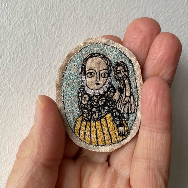 Image of Figure with doll - smaller embroidery portrait brooch 