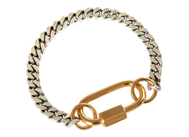 CAUGHT AND BOUND - A PLAY ON INTERLOCKING  -
BOLD AND CHIC IN THE SAME TIME

The 'Bound' bracelet features a flat chunky facetted curbed chain of solid 925 silver.

The modern technical heavy lock which is made of first quality stainless steel, a precious and strong material, which is 32mm long, and 18 karat heavy gold plated. The lock also functions as the connecting part.
