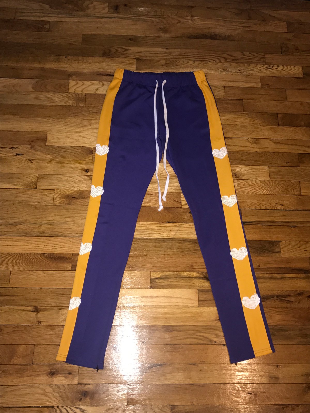 purple and yellow track pants