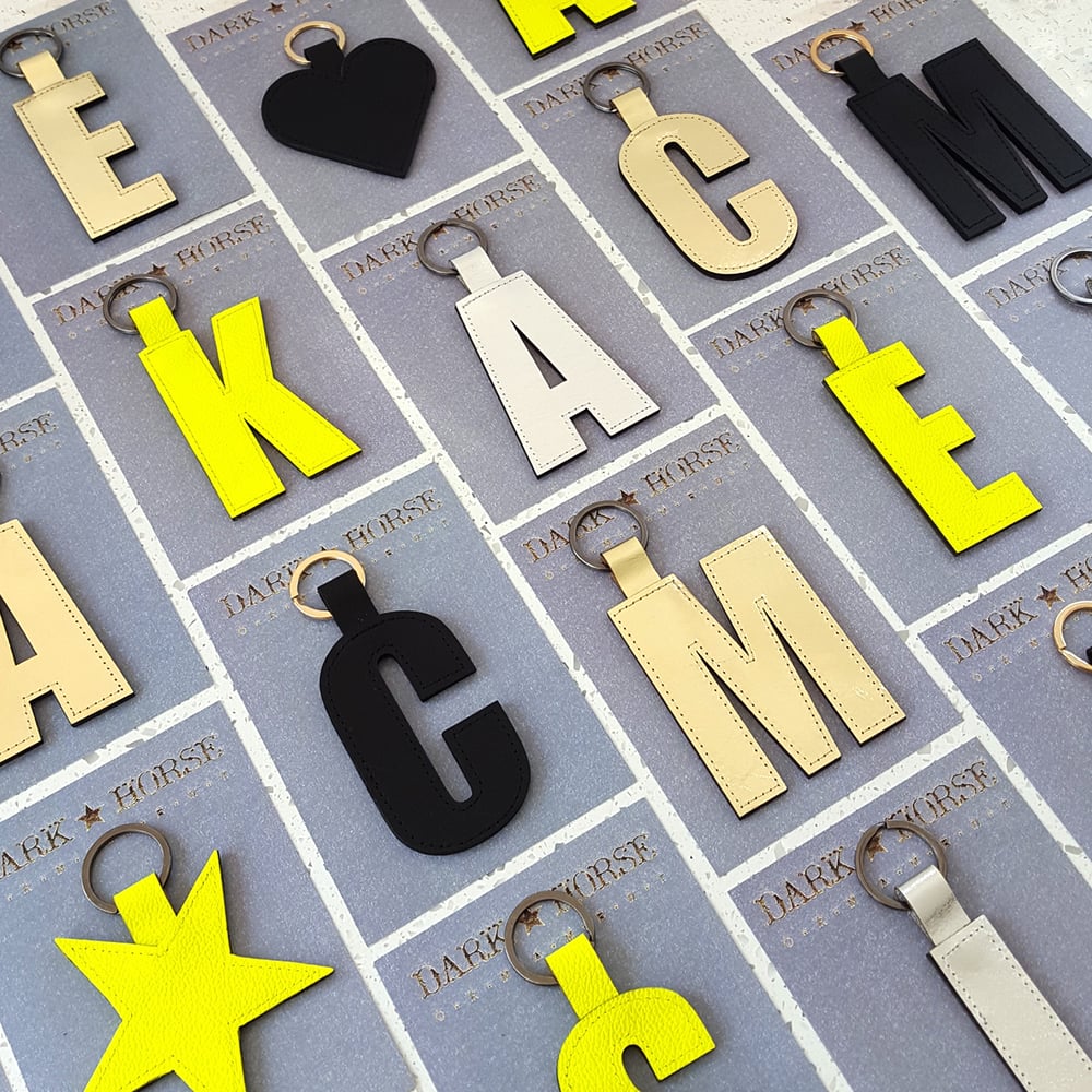 Image of IMPACT alphabet letter keyrings