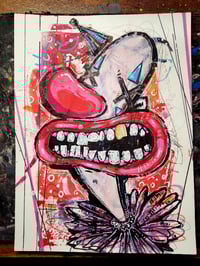 Image 1 of Giggling will hide the tears. 