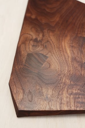 Image of Walnut serving board with natural knot and inlay