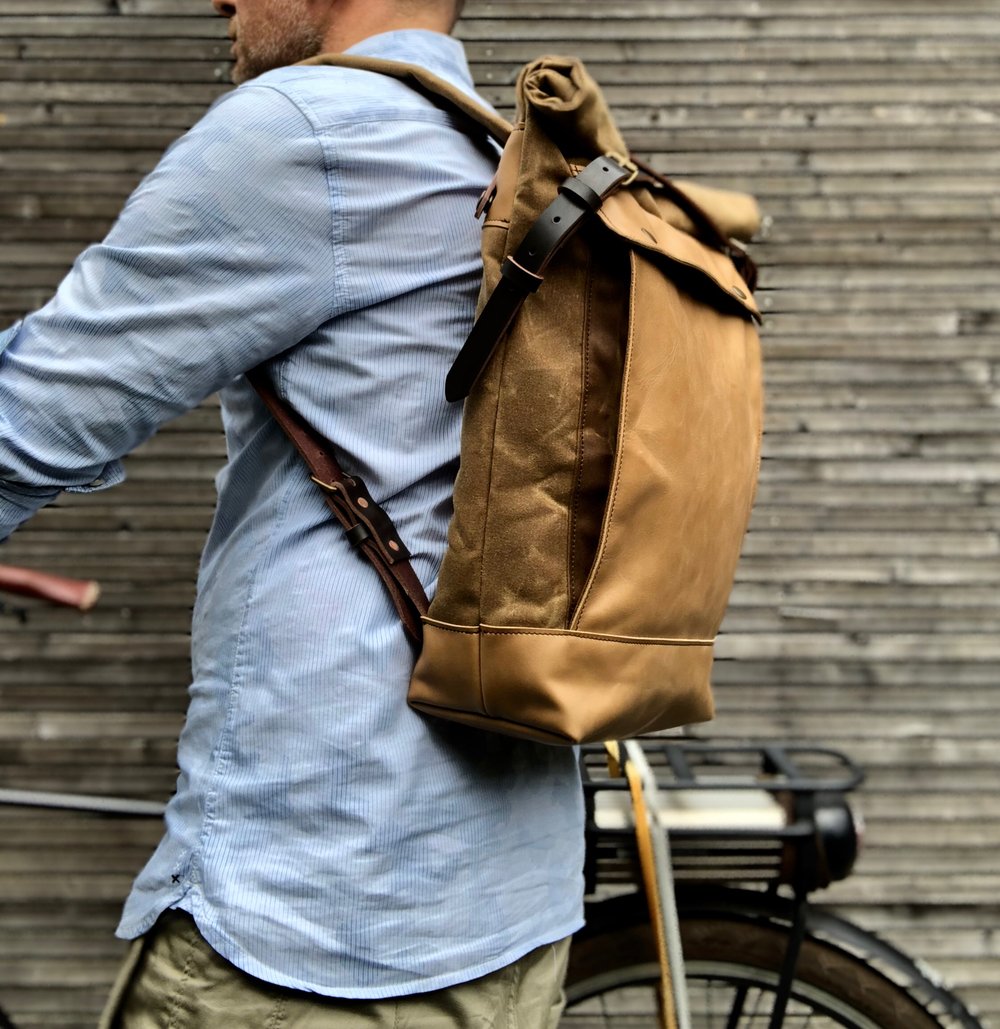 Image of Backpack medium size rucksack in waxed canvas, with leather front pocket and bottom