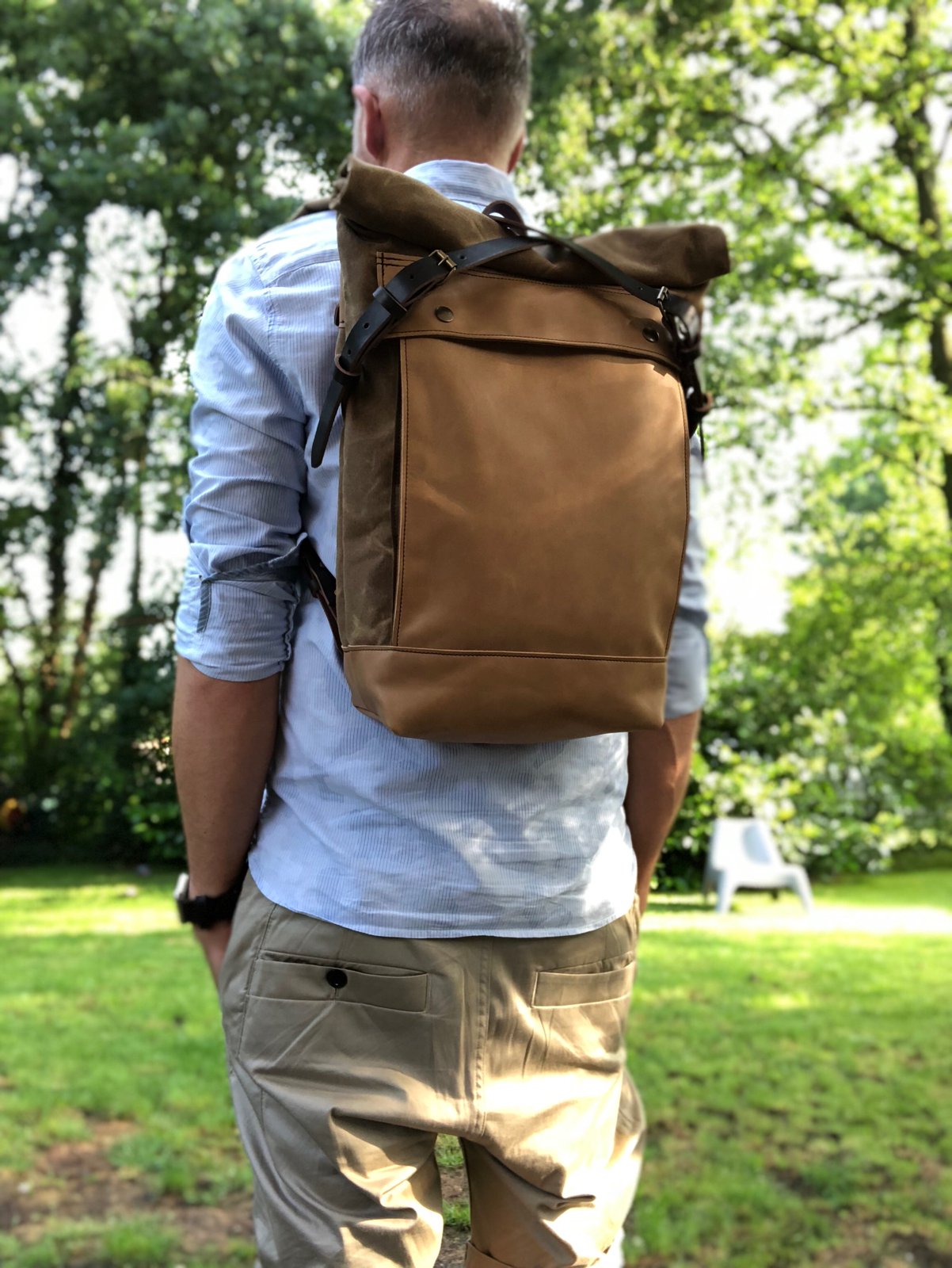 Image of Backpack medium size rucksack in waxed canvas, with leather front pocket and bottom