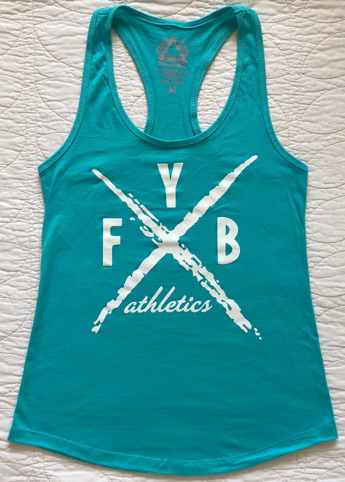 Image of “X” WOMENS RACERBACK TANK - TAHITI BLUE