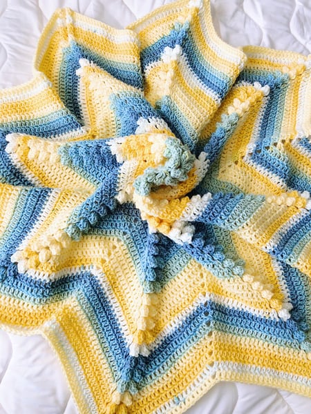 Image of Blue and yellow crochet star blanket