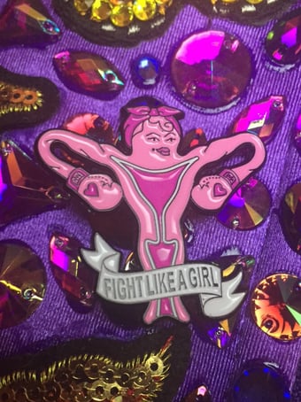Image of Fight Like a Girl Boxing uterus enamel pin