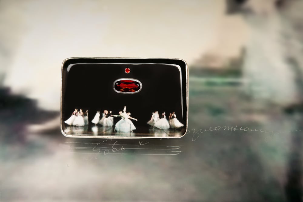 Image of sterling silver brooch with sapphire, garnet and ballet photography under plexiglass